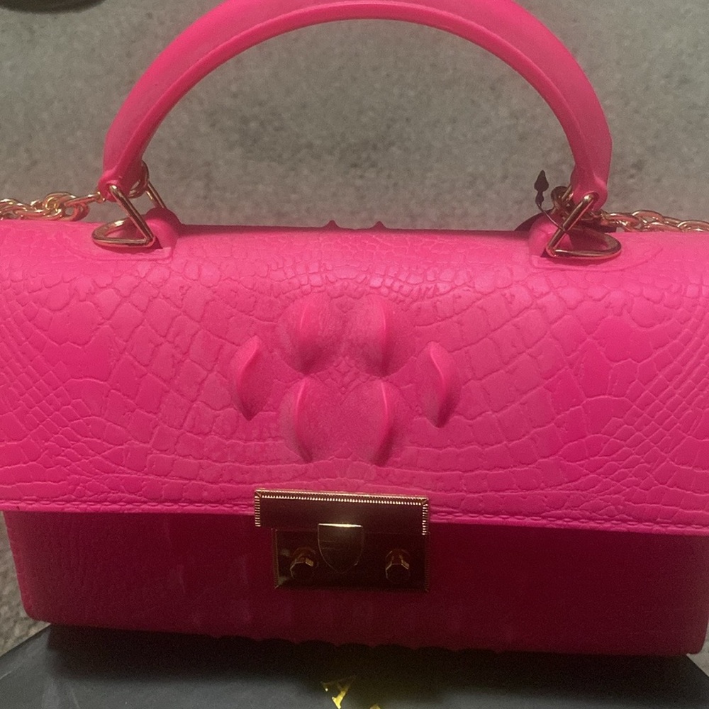Pink handbag with alligator print. Brand new never carried.